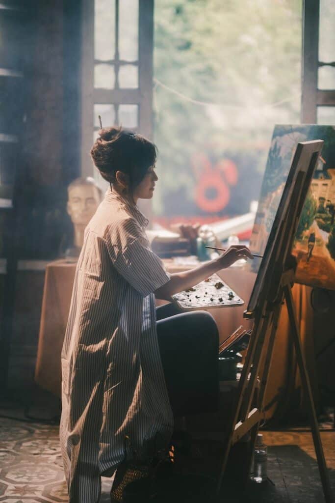 woman painting in an art studio